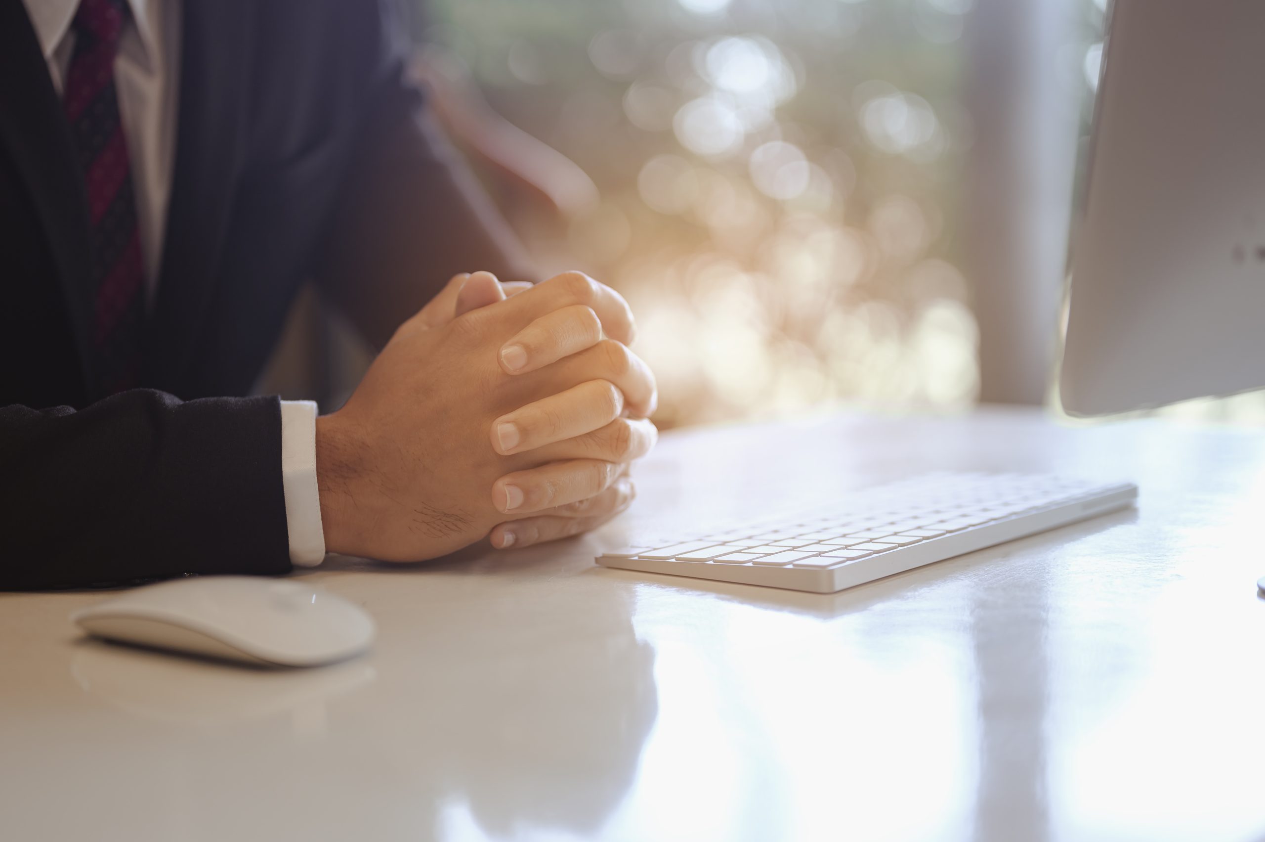 Businessman sitting to working at office desk have a coffee cup beside for efficient work problems and concepts. businessman, working, business, technology, management, planning concepts.
